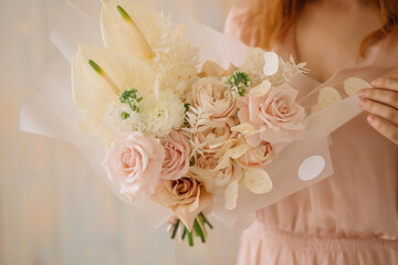 woman holding a bouquet of flowers french rose anthurium dahlias Lunaria ruscus dried flowers mattiola white peony rose