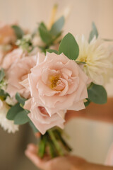 pink roses with flowers in a bouquet for a wedding
