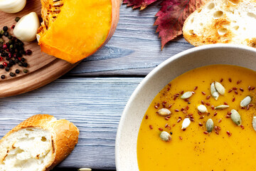 Vegan creamy pumpkin soup with pumpkin seeds.