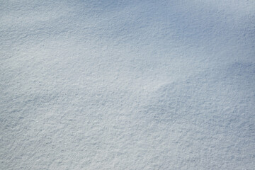 Fresh snow with morning sunlight as background