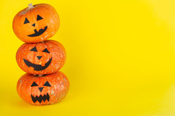 Horror halloween pumpkins on a yellow background