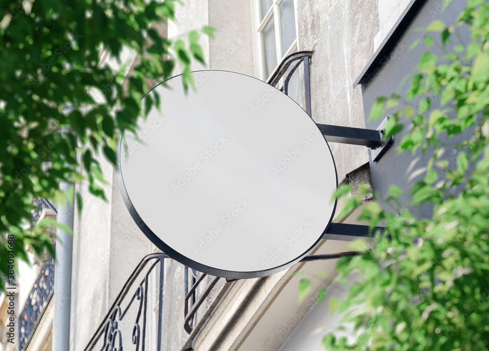 Wall mural circular store brand sign board mockup. empty shop frontage in street