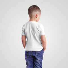 Mockup of a white t-shirt on a junior in blue jeans, standing backwards and with hands in pockets,...