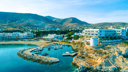 Obraz premium Aerial view of harbor, mountains and living homes at Paros island