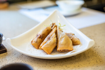 Chinese Cantonese-style morning tea and fried chicken spring rolls
