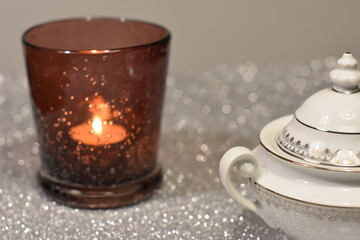 Christmas candle on silver background