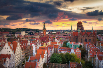 Fototapeta na wymiar Beautiful sunset over the old town of Gdansk with City Hall and St. Mary Basilica, Poland