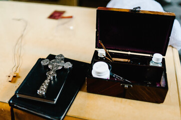 The sacrament of baptism. Attributes of an Orthodox priest for baptism. Baptism in the font. Child...