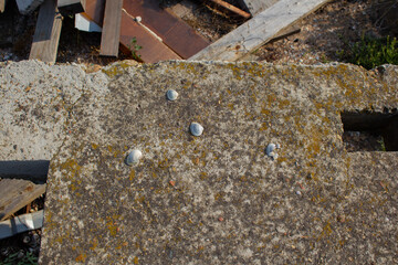 Fototapeta na wymiar Holes in concrete after demolition with a jackhammer on a construction site. Crack in the concrete