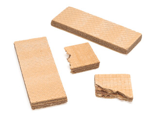 Two biscuit waffles and two pieces of waffles on a white background
