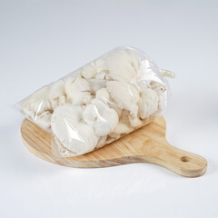 Fototapeta na wymiar Oyster mushrooms that have been harvested are fresh white and ready for consumption, photographed as attractive as possible against a white background.
