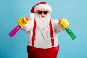 Portrait of his he nice attractive childish comic humorous overweight Santa cleaning up using...