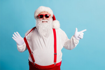 Fototapeta na wymiar Portrait of his he nice attractive cheerful overweight white-haired Santa demonstrating discount advice pulling suspender isolated over bright vivid shine vibrant blue color background