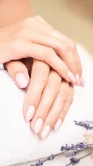 Gordijnen Classic pink wedding nail manicure on white backdrop. Spa treatment concept. Towel background. Natural hygiene. Health care. Beauty spa salon. Salon procedure Woman body care. Lavender flower © elenavolf