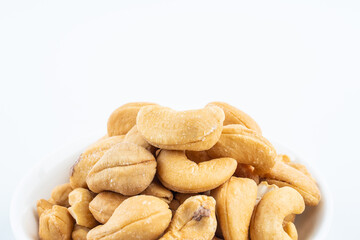 A plate of snacks with salted cashew nuts