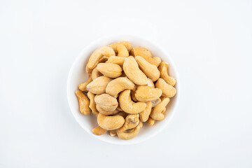 A plate of snacks with salted cashew nuts