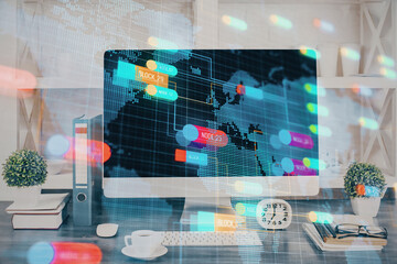 Double exposure of table with computer on background and data theme hologram. Data technology concept.