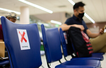 Social distancing the concept of COVID-19: spacing between each chair at the airport.