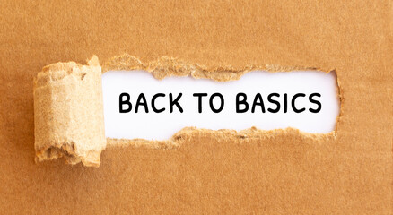 Text Back to basics appearing behind torn brown paperText Culture appearing behind torn brown paper