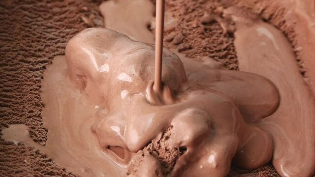 Close up Pouring Melted Surface chocolate ice cream.
