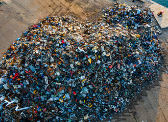 Large heap of metal trash ready to be shipping to recycling.