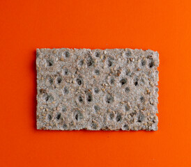 Vegan healthy bread slice on various backgrounds, orange and pink and spaces for text. Ideal for a healthy and balanced diet..Carrot with vegan slice.