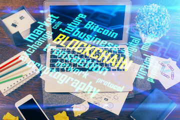 Fototapeta na wymiar Double exposure of blockchain theme hologram and table with computer background. Concept of bitcoin crypto currency.