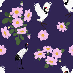 Seamless vector illustration with birds cranes and dahlias.
