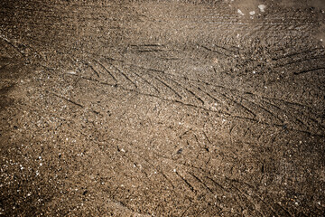 Wheel track on dirty mud