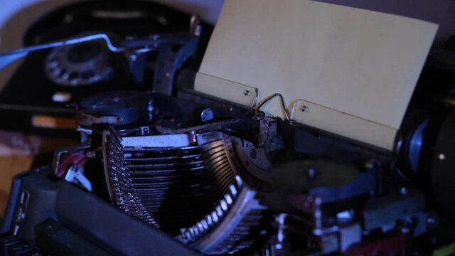 old typewriter on desk, telephone, mystery detective concept, writer's work tools, blue backlight