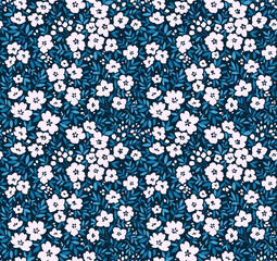 Floral pattern. Pretty flowers on navy blue background. Printing with small white flowers. Ditsy print. Seamless vector texture. Spring bouquet.