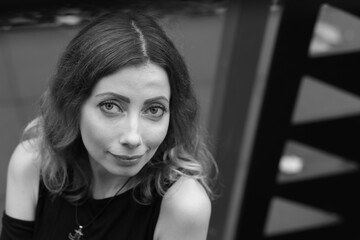 Fototapeta premium Portrait of beautiful woman outside in black and white