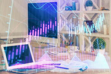 Obraz na płótnie Canvas Financial graph colorful drawing and table with computer on background. Multi exposure. Concept of international markets.