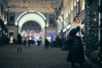 Christmas shopping girl city, young model evening gift shopping, seasonal sale, winter evening outside in the city