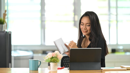 Business female working online while video calling on freelance meeting.