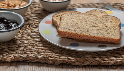 Breakfast. Peanut butter and jelly sandwich on wooden background.