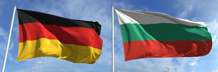 Waving flags of Germany and Bulgaria on flagpoles, 3d rendering