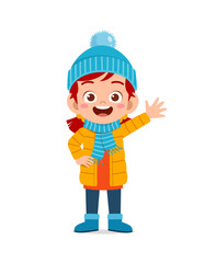 happy cute little kid play and wear jacket in winter season. child smile wearing warm clothes