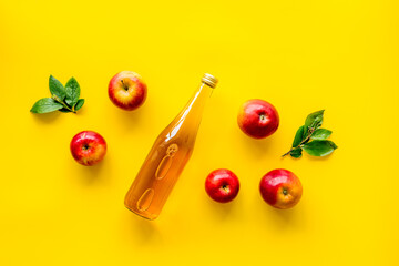 Apple cider vinegar in bottle with fruits top view