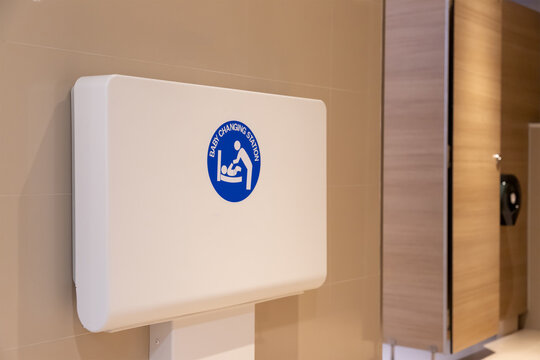 baby changing station in public toilet room. diaper table.