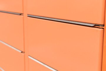 Post office box. Orange post box for rentals.