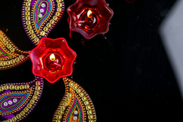 Fototapeta premium Indian festival diwali , Colorful lamps of oil on dark background