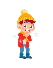 happy cute little kid play and wear jacket in winter season. child feeling chill wearing warm clothes