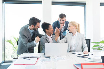 Business people celebrating success at office
