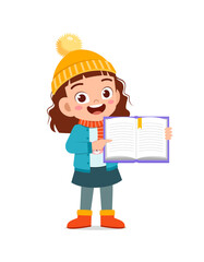 happy cute little kid study and wear jacket in winter season. child read book wearing warm clothes