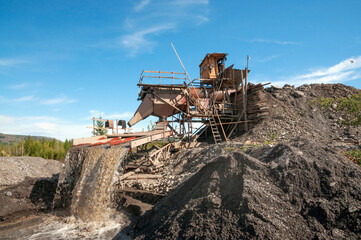 Industrial equipment in the mountainous region of Eastern Siberia, where natural gold is mined.
    Several tons of mountain soil are poured into the hopper of this device, and all this is washed out 