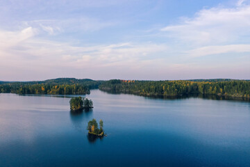 Drone shot of islands, lake and forest in autumn in Heinola, Finland