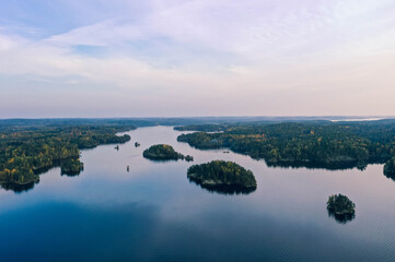 Fototapeta premium Drone shot of islands, lake and forest in autumn in Heinola, Finland