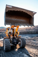 Wheel loader during earthworks in mountainous area - Mining
