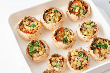 Stuffed mushrooms with vegetables on a baking dish. Vegetarian food